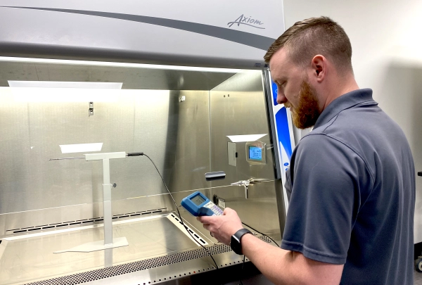 Labservco Employee Repairing Biosafety Cabinet