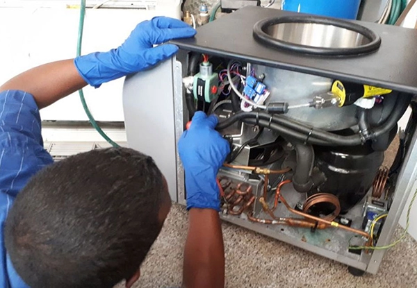 Labservco Employee Repairing Freeze Dryer